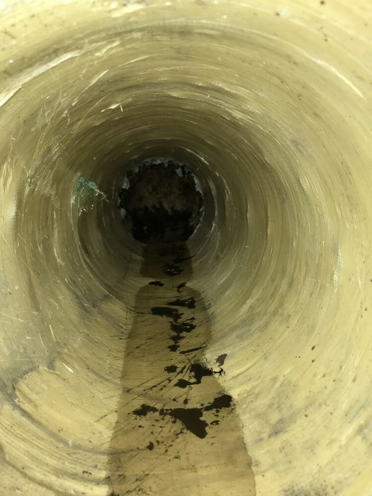 Interior view of a large, empty sewer pipe in Chicago Heights IL